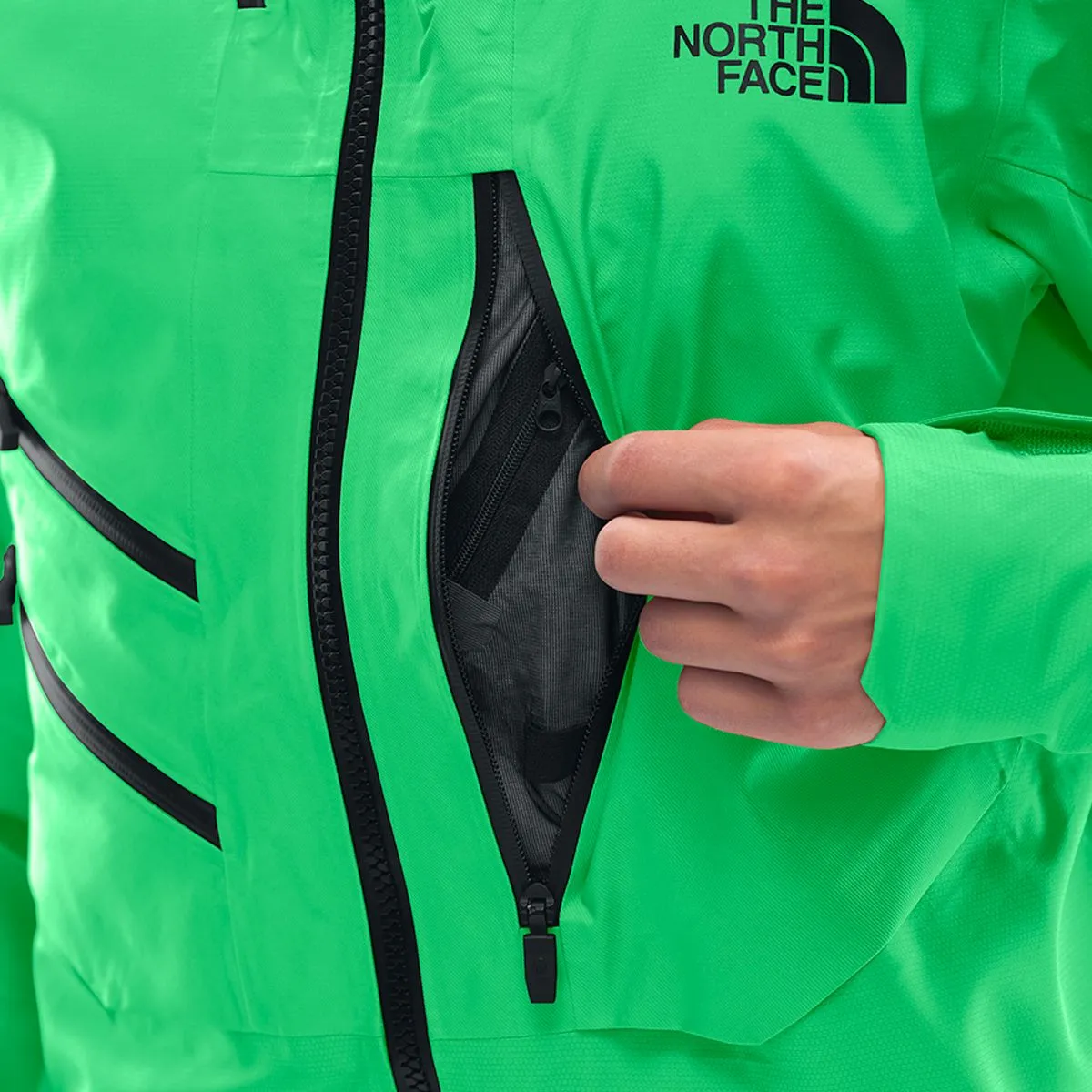 Close-up of the jacket's zippered chest pocket and The North Face logo